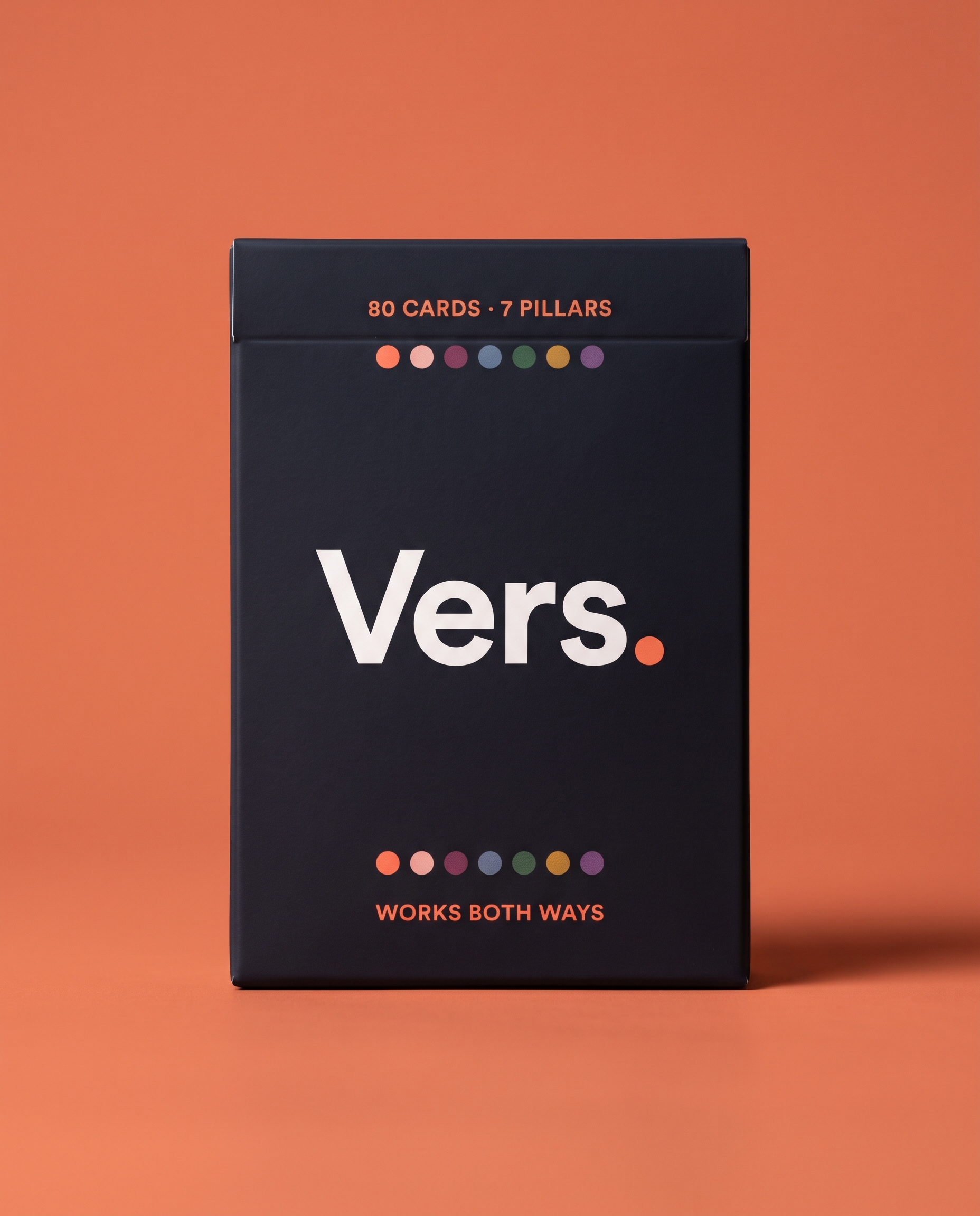 The Vers. deck box on a coral background