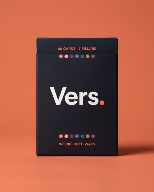 The Vers. deck box on a coral background
